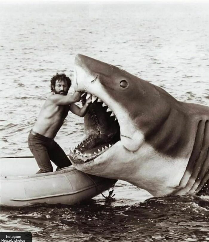 48. Production designer Joe Alves fixing the mechanical shark in 'Jaws'.