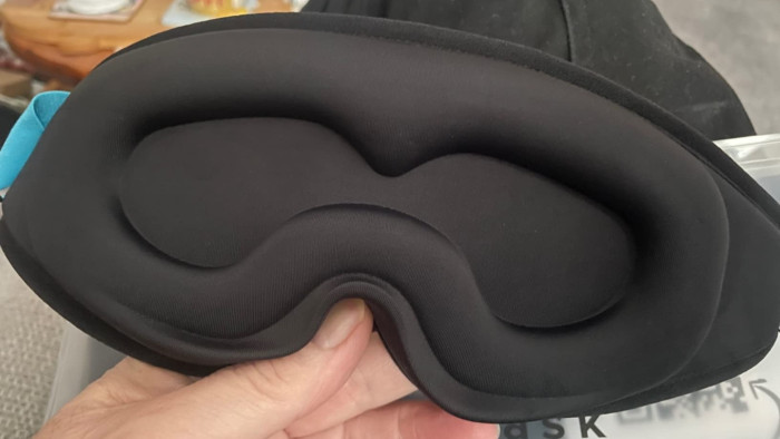 MyHalos blackout sleep mask on pillow, emphasizing enhanced sleep quality