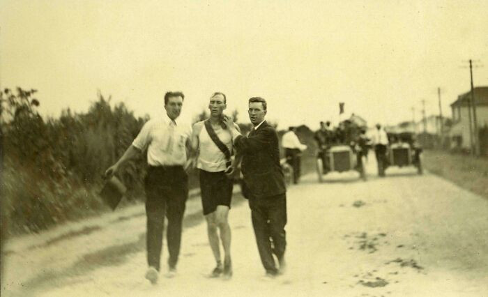 "Handlers Support Thomas Hicks During The 1904 Olympic Marathon After Dosing Him With Strychnine, Egg Whites And Brandy He Won"