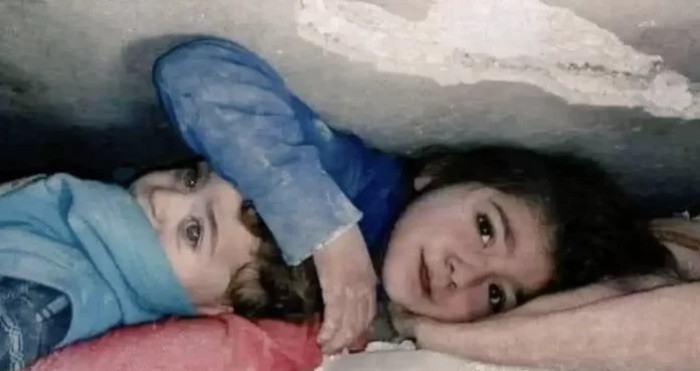The 7-year-old Syrian girl has spent around 17 hours stuck under rubble, and all this time she tried to protect her little brother