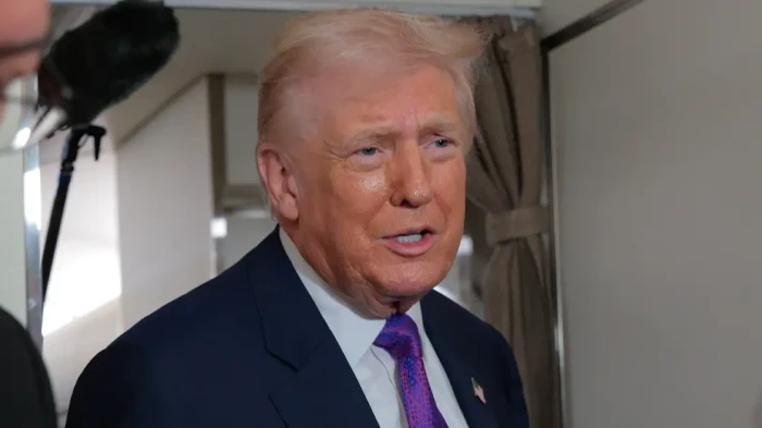 Donald Trump speaking at a news event about Andrew Mountbatten-Windsor detention