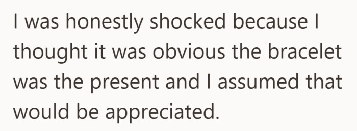 She thought it was obvious the bracelet was the present, which made the reaction feel confusing.