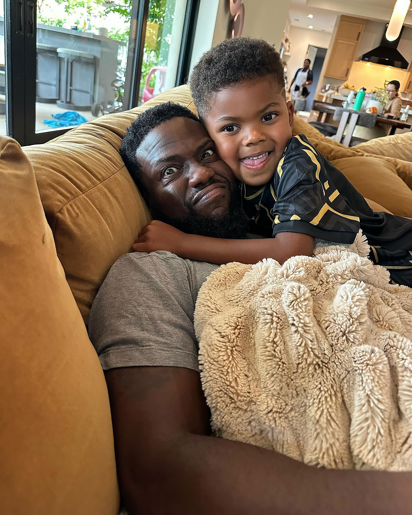 7. Kevin Hart snuggled up with his son Kenzo