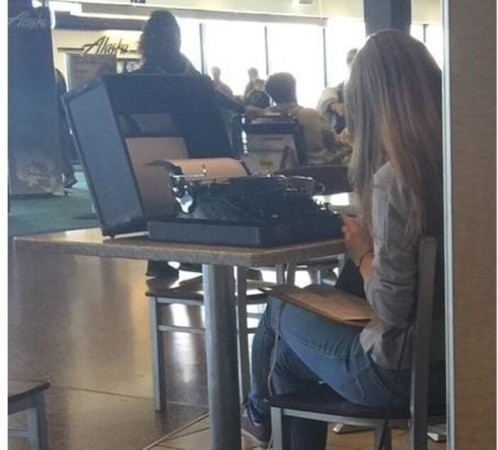 17. This woman brought a whole typewriter to the airport.