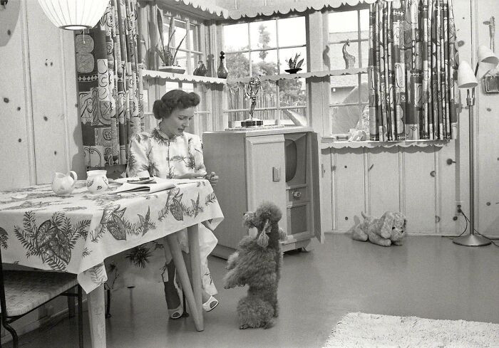 2. Betty White in her Los Angeles home with her dog, 1952.