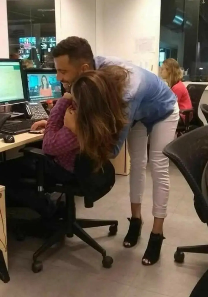 11. It looks like the man wearing heels is hugging the woman.