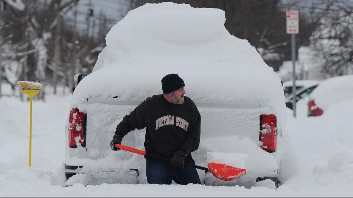Emergency crews and stranded vehicles in New York during historic snowfall conditions