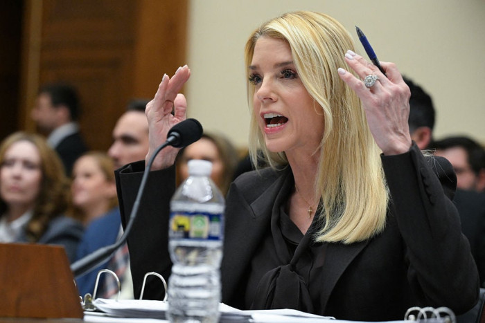 Pam Bondi speaking at a press event, addressing scrutiny over Trump’s Epstein ties
