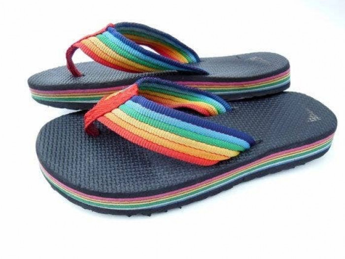 49. That every child had a pair of these rainbow flip-flops, which were also very uncomfortable because the nylon on the straps rubbed against your toes: