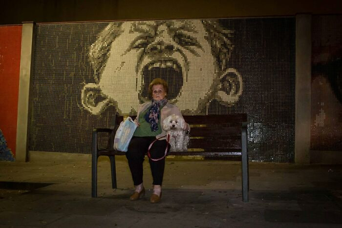Street scene with a person looking sideways, suggesting self-recognition and reflection.