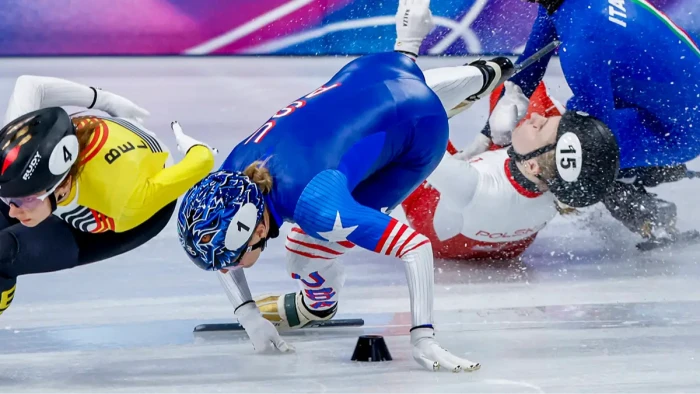 Athlete lying on medical bed, team monitoring eye swelling after blade collision