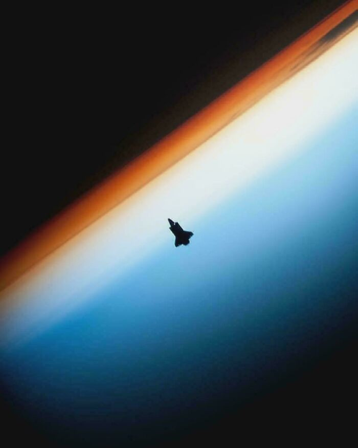 "Space Shuttle Endeavour Silhouetted Against Earth’s Horizon As It Approaches The International Space Station For Docking During The Sts-130 Mission"