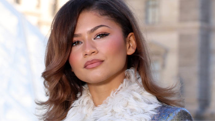 Zendaya and co-star in a wedding-themed drama, highlighting fashion buzz.