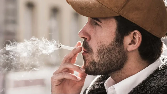 Close-up of cigarette smoke, illustrating health effects after one cigarette