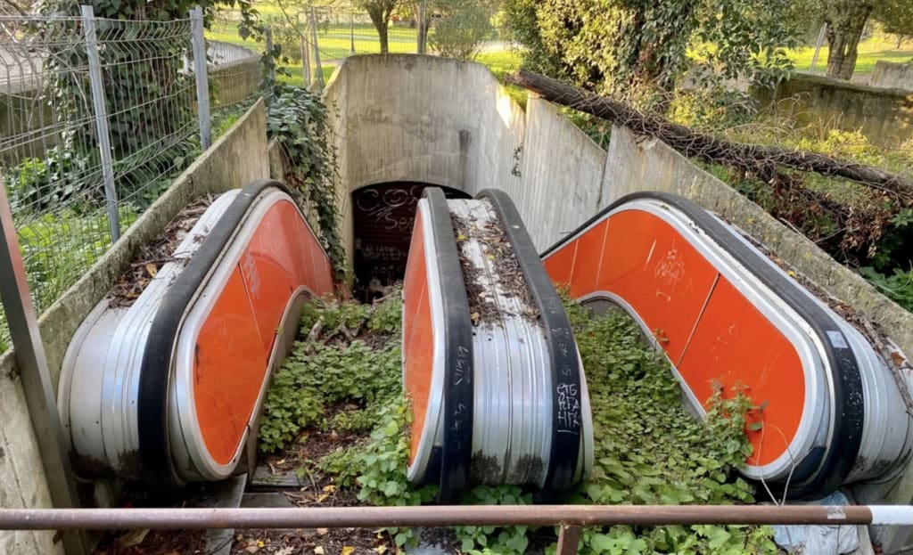 28. “An escalator to Spagna Metro Station in Rome.”
