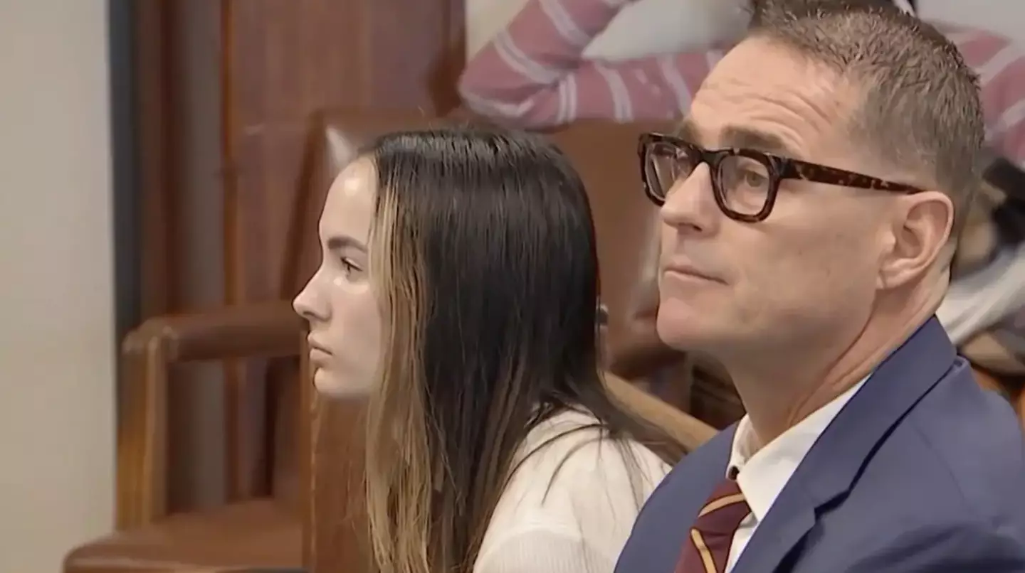 Shelby Hewitt sits beside her lawyer, Timothy Flaherty, as she faces the courtroom spotlight after her mind-boggling charade. (NBC Boston)