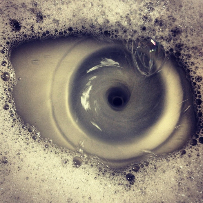 30. Out of boredom, I tried to take a photo of a my sink draining, I got a photo of an eye shaped whirlpool instead.