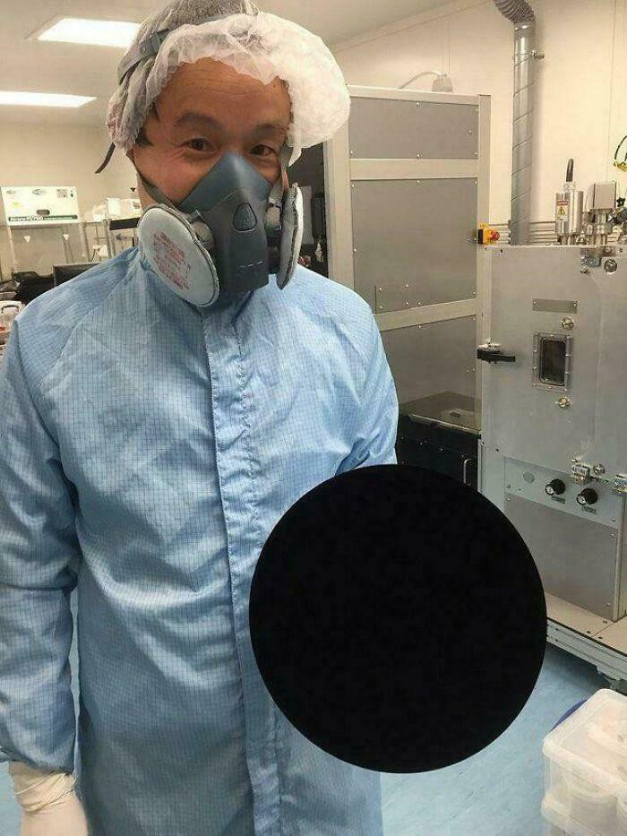 'Scientist Holding A Basketball Covered With Vantablack, The World's Blackest Substance'