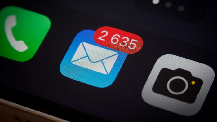 Mobile device showing messages, highlighting default email signature value in workplaces