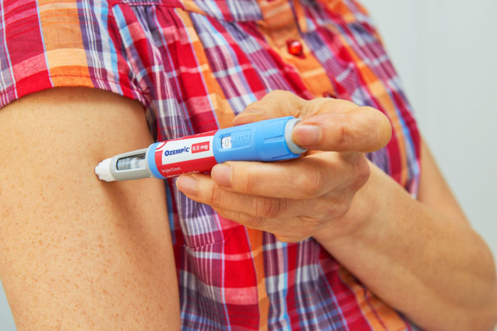 Semaglutide medication packaging and syringes, highlighting weight loss benefits and vision risk warnings