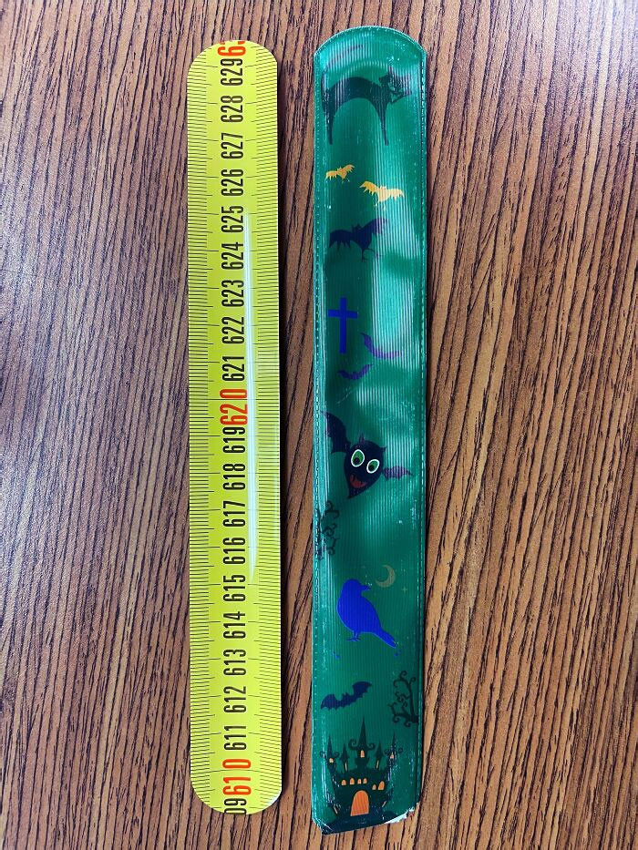 38. The person repurposed a child's Halloween snap-on bracelet by cutting it open, only to discover that it was actually a tape measure.