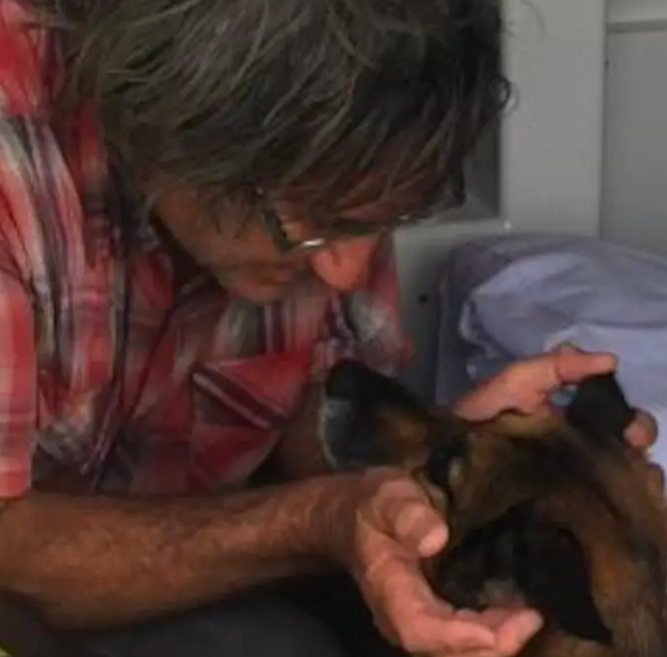 When the rescuers arrived, they found the 63-year-old man on his partially sunken boat. He was overjoyed to discover that his dog was alive.