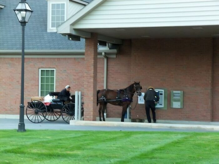 "An Amish Man Withdrawing Cash From An ATM In Pennsylvania"