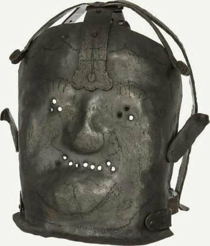 A grim artifact from the 17th century, this heavy metal mask was once used to confine and control people labeled as mentally unstable, reflecting the harsh and often cruel methods of the era.