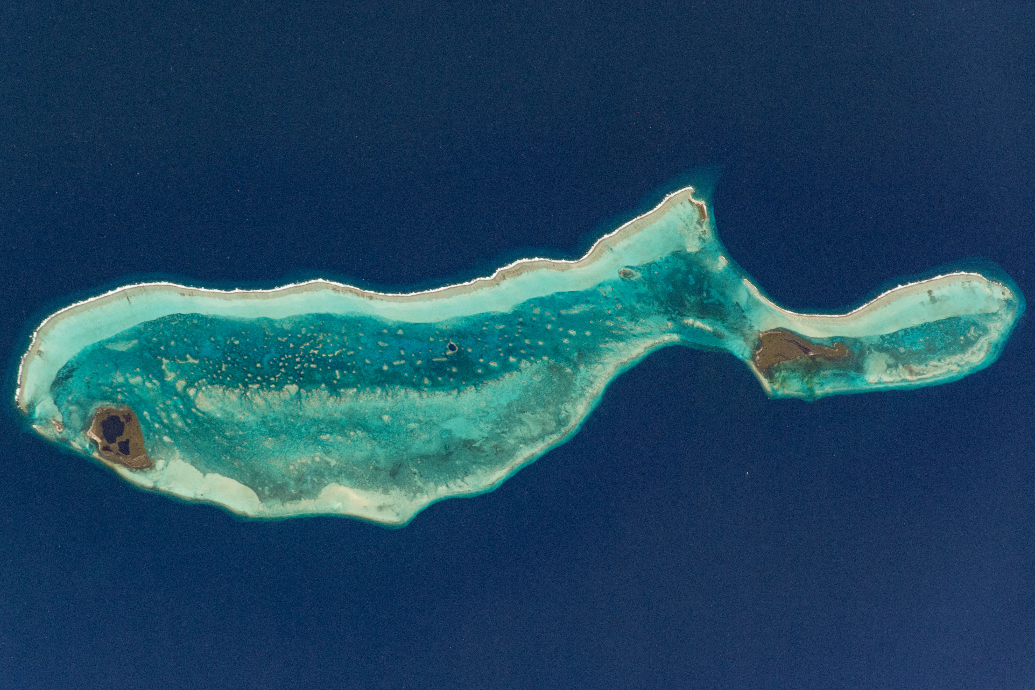 The Great Blue Hole lies near the center of the Lighthouse Reef atoll
