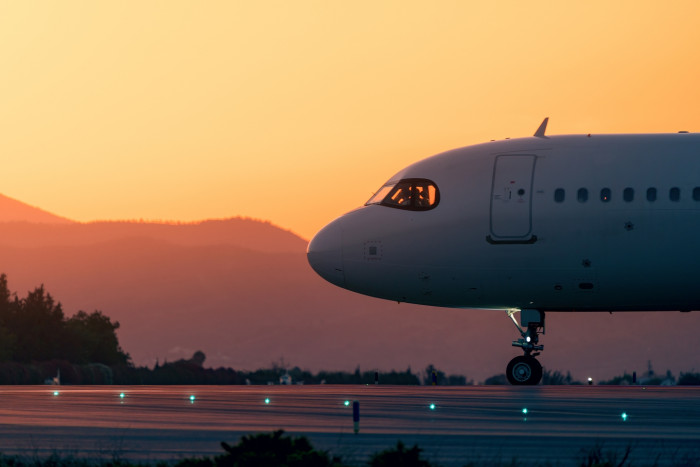 Airline terminal at night, referencing alleged pilot impersonation for complimentary flights