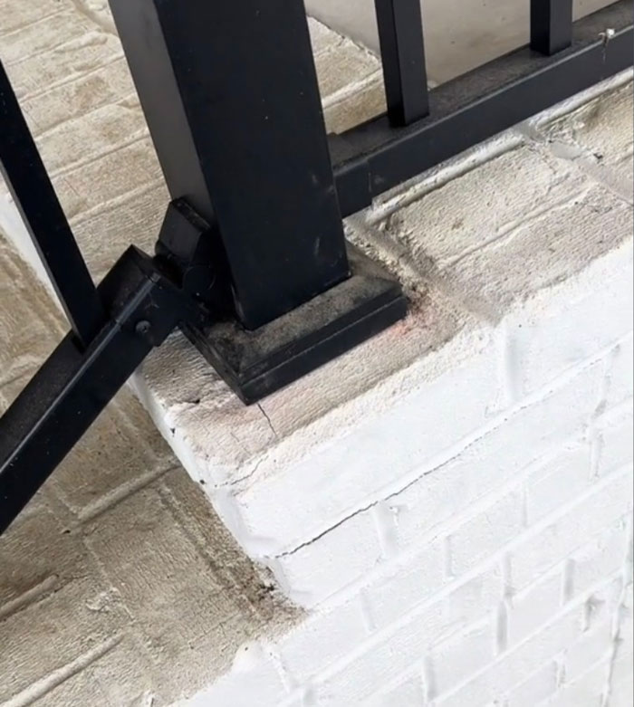 “Always got to grab our railings to make sure they’re nice and secure, but this one right here is not because the brick is moving.”