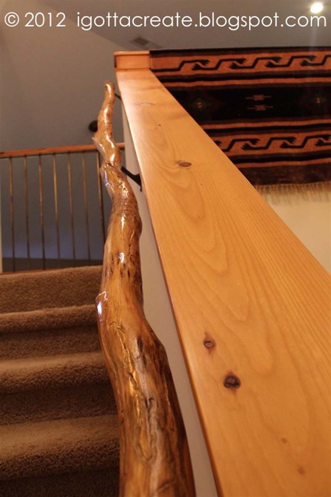 2. Craft a rustic handrail using a tree branch.