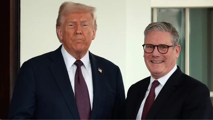 RAF airfield perimeter and aircraft hangar, UK-US relations strained over Iran operations.