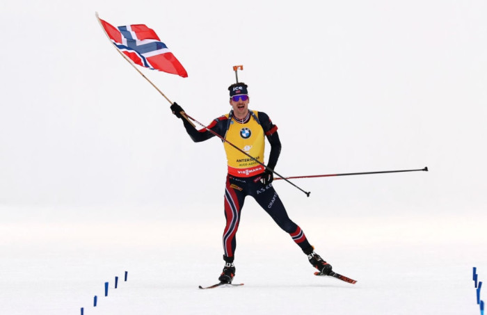 Biathlete Johannes Thingnes Bø or Lægreid in competition, news headline overlay.