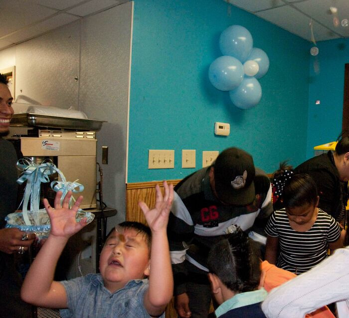 "I Took A Picture Of This Kid Getting Hit In The Face By A Coin During A Baptism Party A Few Years Ago"