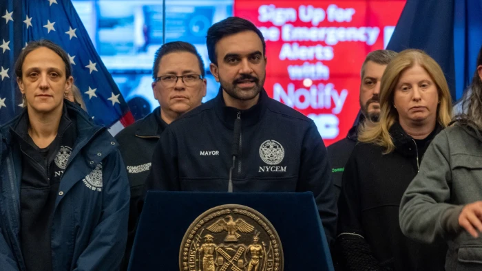 Street scene showing parking suspension, essential vehicle access, and grounded flights.