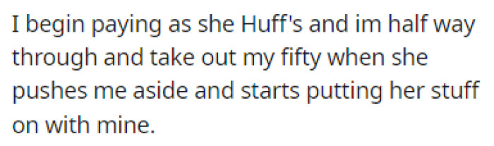 OP was paying for his things when the woman started putting her stuff