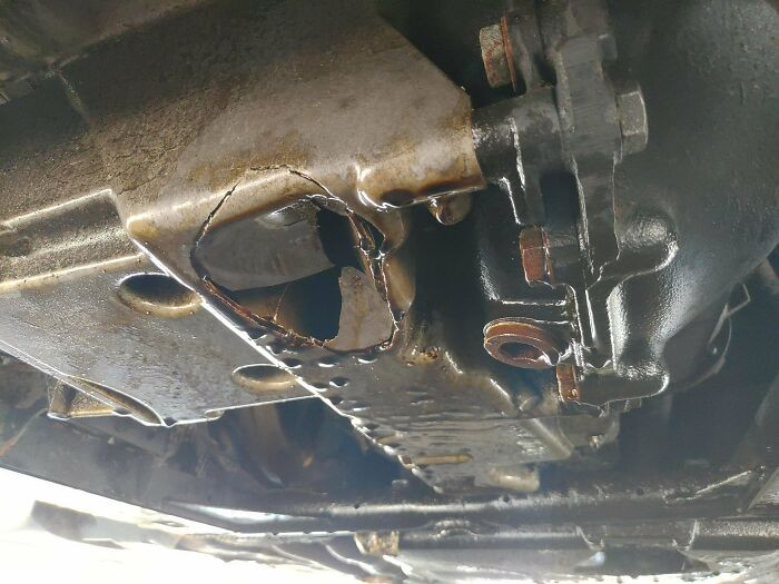 "Chunk Of Asphalt Kicked Up And Put A Hole In My E46 BMW Oil Pan. Got The Car Home With 1-Minute Gasket Maker, A Can Of Pepsi, And Some Gas Station 10W-30"