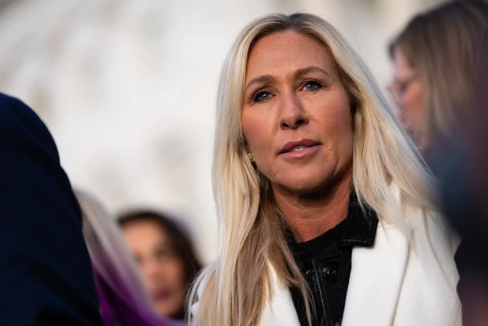 Marjorie Taylor Greene speaking critically, referencing Andrew’s arrest and investigations