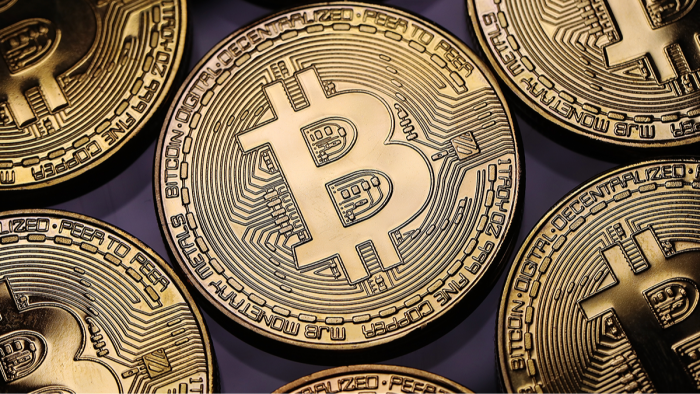 Long-term Bitcoin holder gesture with HODL message, emphasizing staying calm amid dips.