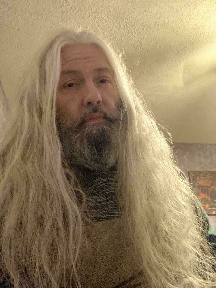 Strawberry blond man with long hair, “Never Cutting” community response caption