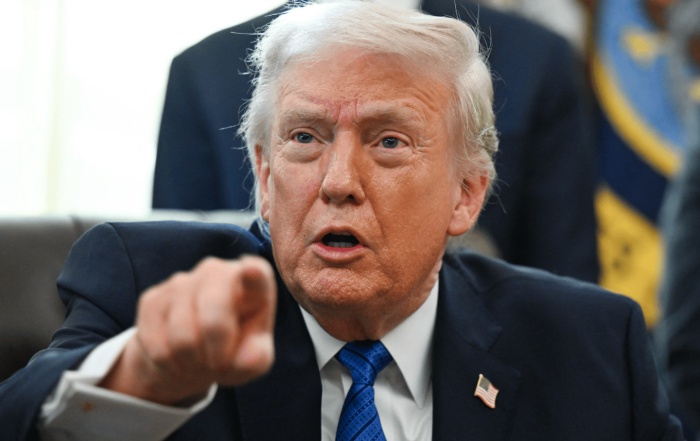 Donald Trump speaking at a press event amid renewed Epstein scrutiny headlines.