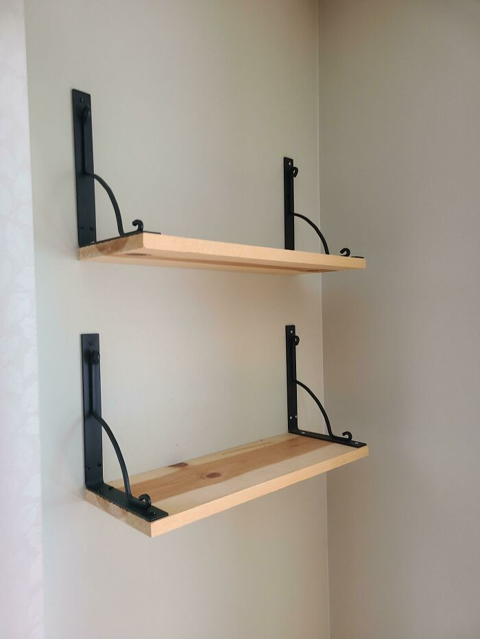 11. Inverted Ekby Hall wall brackets used to create natural bookends for the shelf