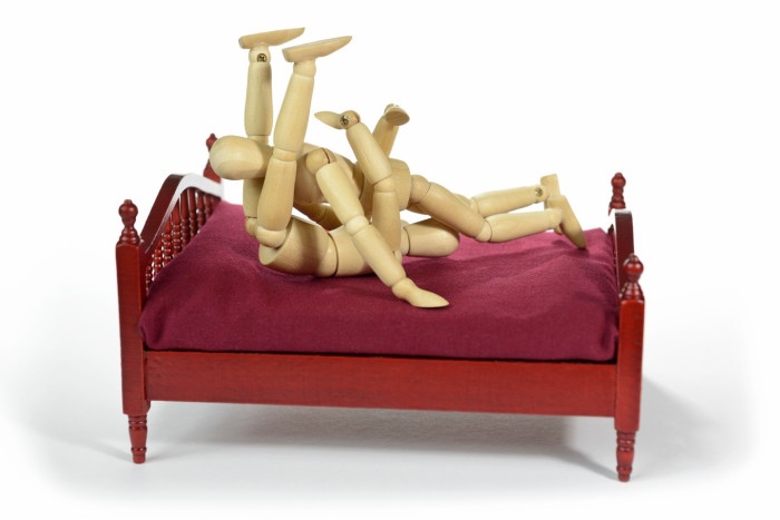 Couple discussing intimate preferences, emphasizing shared views on sexual positions