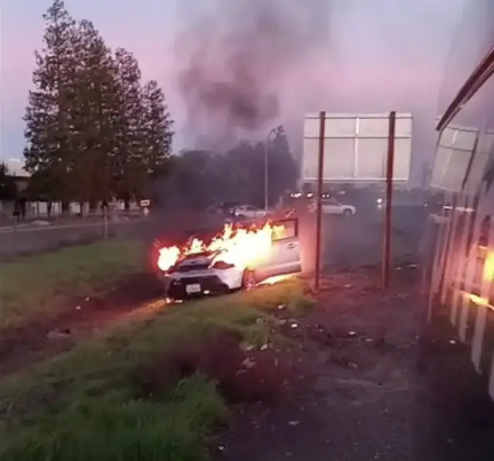 The man whose car was on fire called out in anguish, 