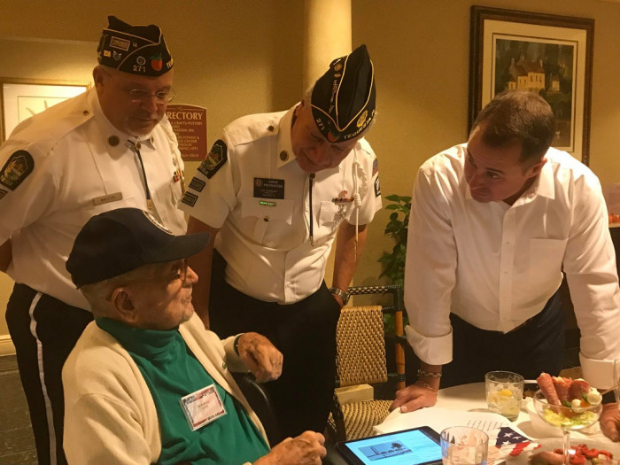 9. My grandpa (93-year-old WWII vet) surrounded by vets from different generations, telling them his war stories. He was SO happy they wanted to listen; it made his week.