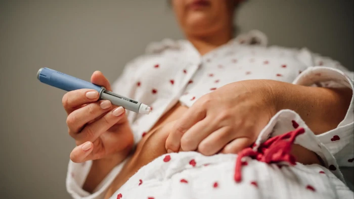 Healthcare professional discussing GLP-1 weight loss injections and sleep quality effects