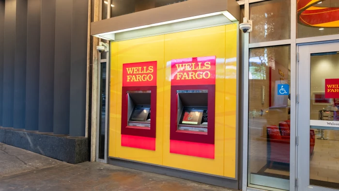 Homeowner reviewing check and rights guidance for Wells Fargo settlement deadline