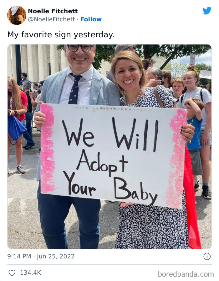 1. Here we have the infamous couple with their cute sign, a photo that went viral on Twitter in a heartbeat