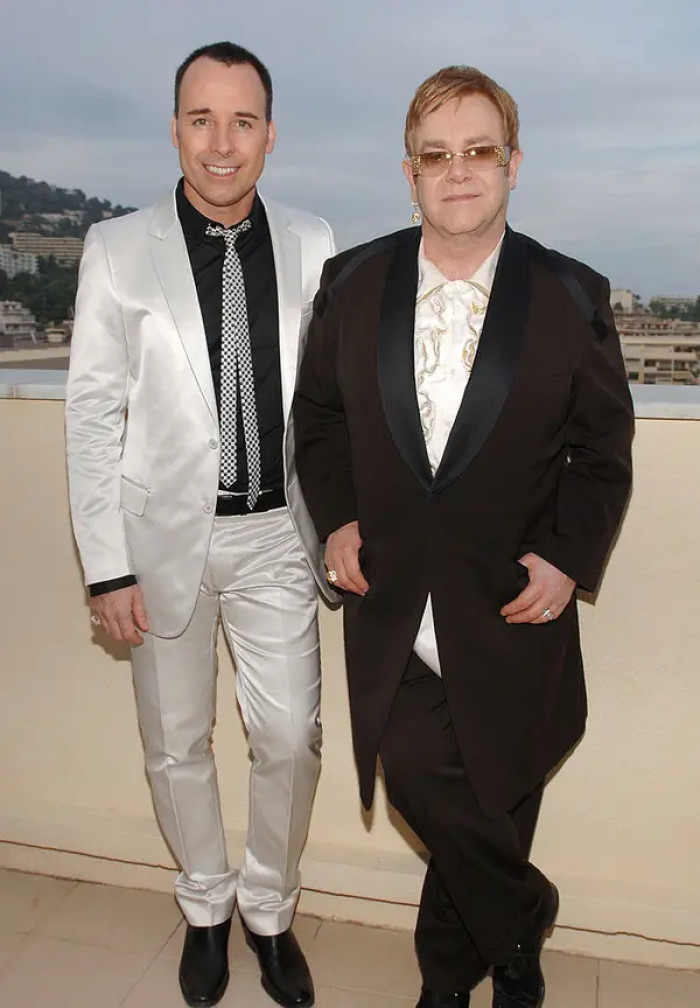 52. David Furnish and Elton John